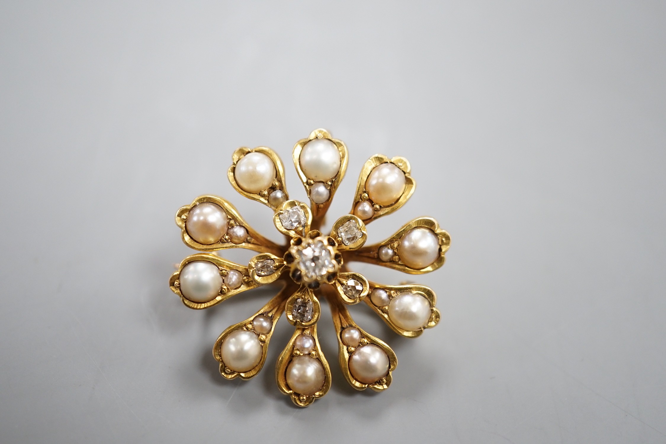 A Victorian yellow metal (tests as 15ct), diamond and split pearl set pendant brooch, 26mm, gross weight 6.9 grams.